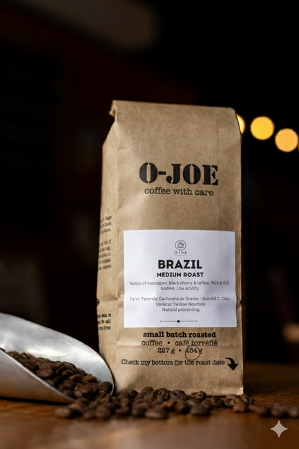-JOE Brazil Medium Roast coffee beans in a kraft bag with a silver scoop on a wooden table